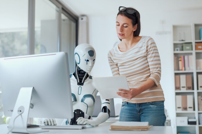 Woman and AI robot working together in the office