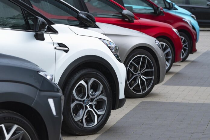 Berlin, Germany - 17th September, 2020: Cars parked on a public parking. Often find a free parking place in the city center is a very difficult. Focus on a second car.