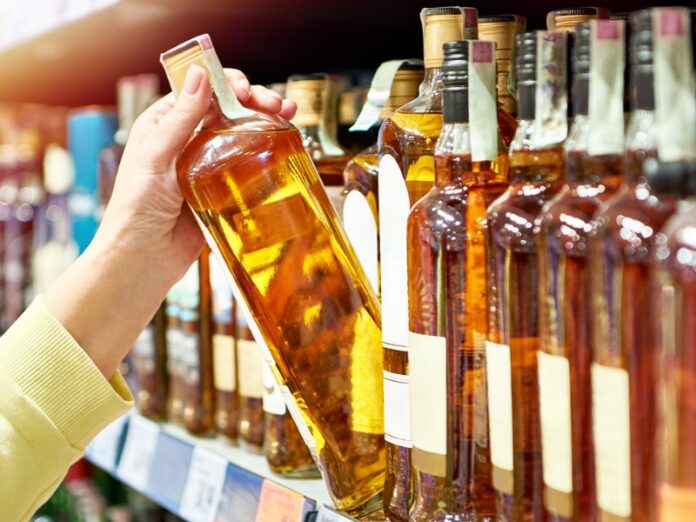 Whiskey bottles on a retail store shelf